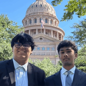 Two Youth Leadership Council Members in front of the Texas Capitol.