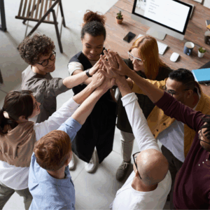 A team of people high fiving